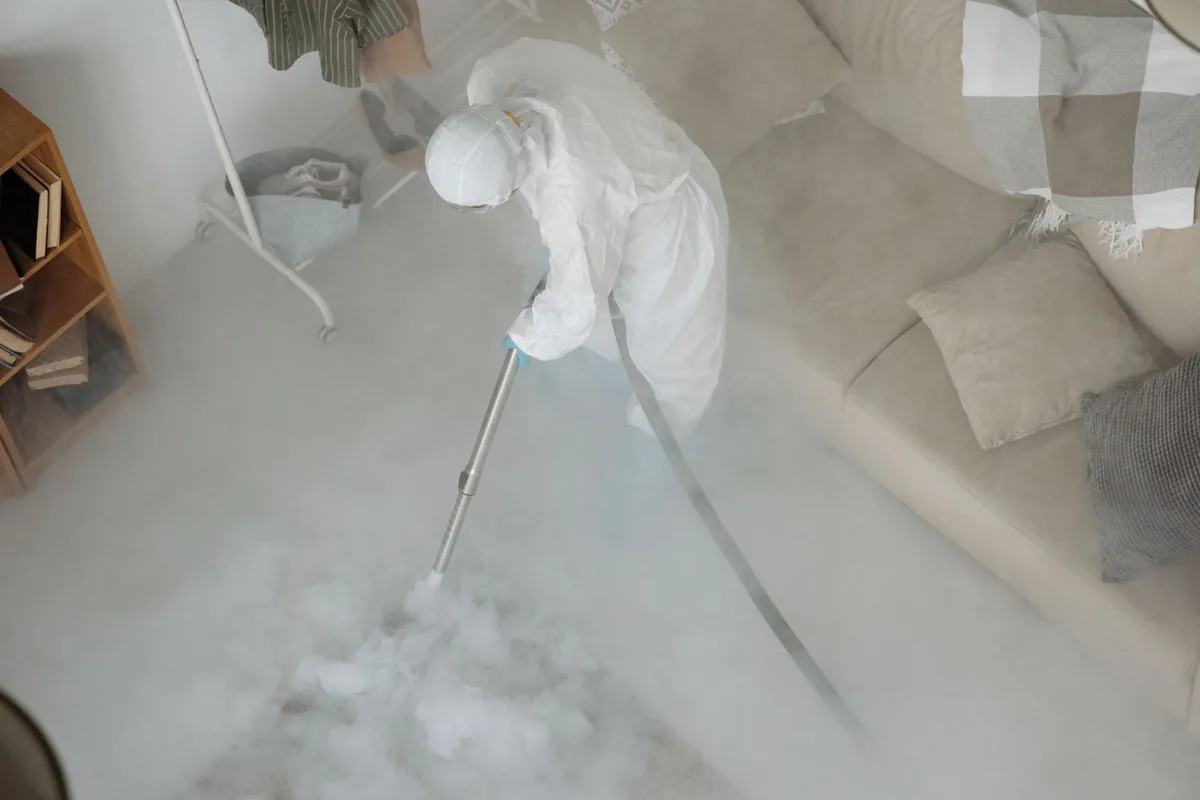 Biohazard cleanup technician in protective equipment, Southbridge Town, MA